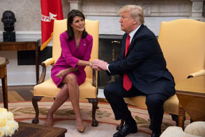 Nikki Haley, then U.S.-ambassador to the United Nations, shakes hands with President Donald Trump after she announced her plan to resign, in the Oval Office on Oct. 9, 2018.