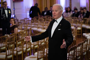 President Biden arrived in the East Room of the White House on Saturday before the start of country singer Brad Paisley's performance at an event for US governors and their spouses.