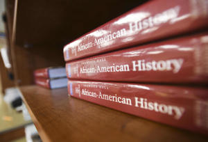 Textbooks sit on a shelf at a high school in Birmingham, Alabama.