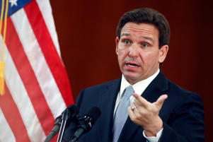 Florida Gov. Ron DeSantis answers questions from the media at the Florida State Cabinet after addressing the State of the State during a joint session of the Senate and House of Representatives, Tuesday, March 7, 2023, at the Capitol in Tallahassee, Florida.