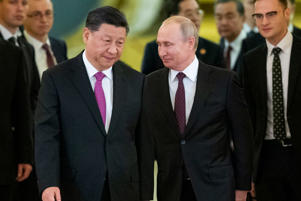 FILE - Chinese President Xi Jinping, left, and Russian President Vladimir Putin enter a Kremlin meeting room in Moscow, Russia June 5, 2019. China announced Friday March 17, 2023 that President Xi will travel to Russia starting Monday. Until Wednesday, March 22, 2023, in a show of support for Russian President Putin in the context of rising East-West tensions over the Ukraine conflict.