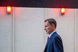 Image: Jeremy Hunt gives a TV interview after being appointed the new British chancellor (Chris J Ratcliffe/Getty Images)