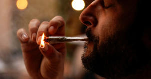 A customer lights cigarettes at Lowell Farm, America's first farm-to-table legal cannabis cafe, and smokes weed in West Hollywood, California on October 1, 2019.
