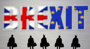 FILE PHOTO: A small toy figure can be seen in front of the Brexit logo in this photo illustration