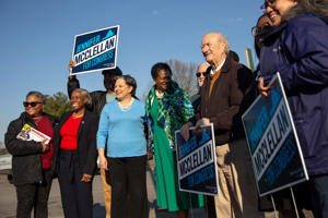 Democratic congressional candidate Jennifer McClellan talks with supporters and other politicians outside John Rolfe Middle School in Henrico County, Va., on Tuesday.