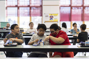 Students eat lunch at Palmer Lake Elementary School, Monday, Feb. 28, 2022, in Monument, Colorado.