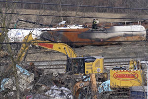 On Tuesday, workers continue to remove the remaining tanks in East Palestine, Ohio, after the wreck of the Norfolk Southern freight train on February 3.