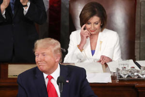 WASHINGTON, DC - FEBRUARY 4: President Donald Trump addresses the State of the Union as Speaker Nancy Pelosi (D-CA) looks on at the United States House of Representatives on February 4, 2020 in Washington, DC. The night before the US Senate votes on his impeachment, President Trump delivers his third State of the Union address. /fake pictures