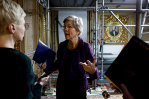 Sen. Elizabeth Warren, D-Mass., speaks to a reporter outside the Senate chambers during a vote at the United States Capitol on March 14, 2023 in Washington, DC. Senators resumed the session this week amid the government's response to the closure of Silicon Valley Bank and Signature Bank.